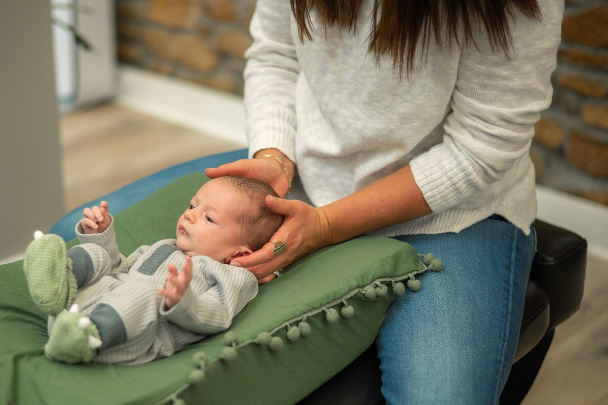Gentle pediatric chiropractic care for infant in Topeka - addressing colic, reflux, and developmental support